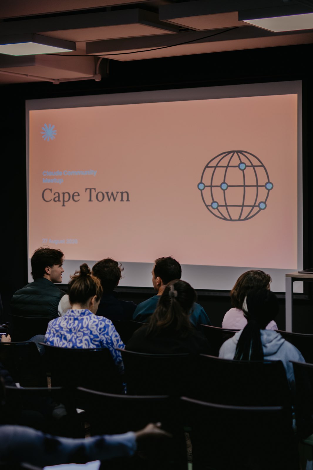The room watching the Cape Town opening slide